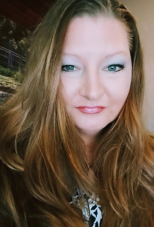 lady posing for photo with green eyes